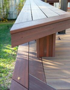 Prestige Woodworks - Christian Neudecker - Deck Builder - 2 Tiered Composite Deck, Double Boarded Fiberon Horizon Line Colour Cinnabar, Main is Fiberon Horizon Line in Colour Ike - Compass is in Fiberon Horizon Line in Colours Tudor Brown and Cinnabar - Border is face screwed and colour matched plugs - Fully Customized Railing System - 4 Custom Staircases - Customized Bench fully Clad in Matching Composite Boarded in Cinnabar to match deck with Covered matching Fascia Boards on Bases